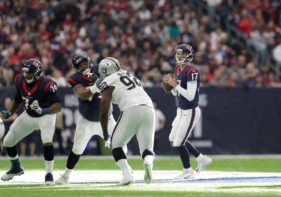 Houston Texans quarterback Brock Osweiler (17) works against the Oakland Raiders during the fir ...