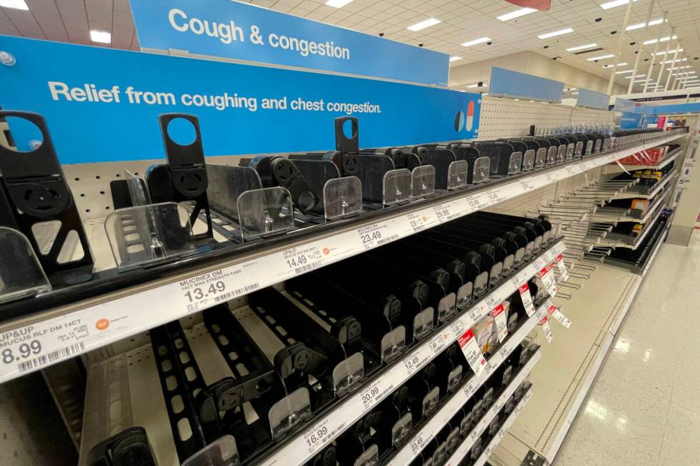Empty cold and cough medicine shelves are seen at Target, 3210 N Tenaya Way, in Las Vegas, Thur ...