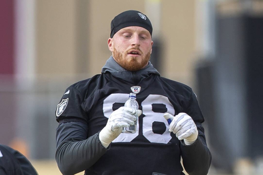 Raiders defensive end Maxx Crosby (98) stretches during practice at Raiders headquarters at the ...