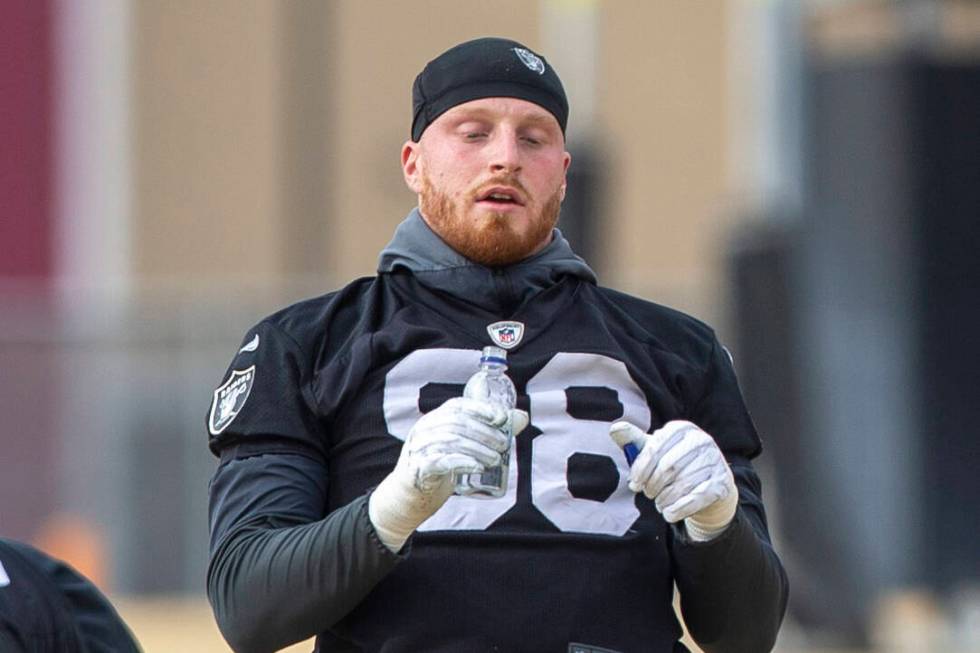 Raiders defensive end Maxx Crosby (98) stretches during practice at Raiders headquarters at the ...