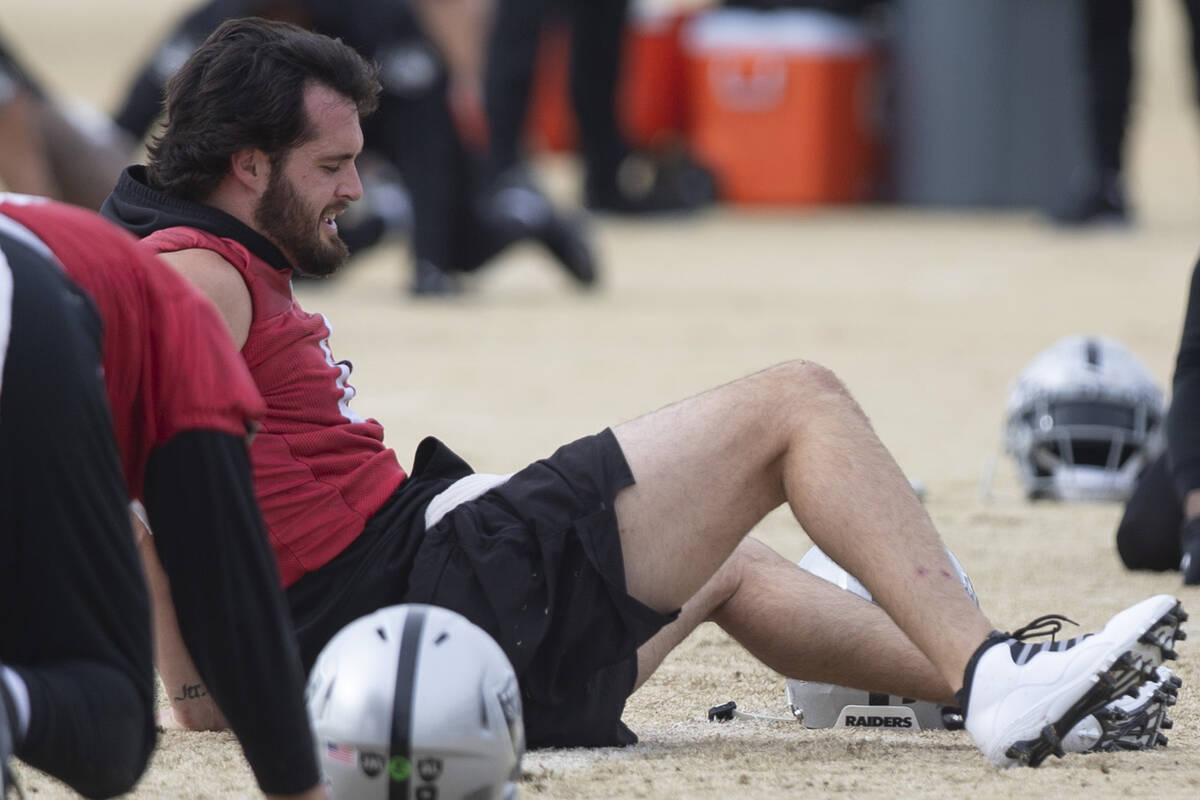 Raiders quarterback Derek Carr (4) stretches during practice at Raiders headquarters at the Int ...