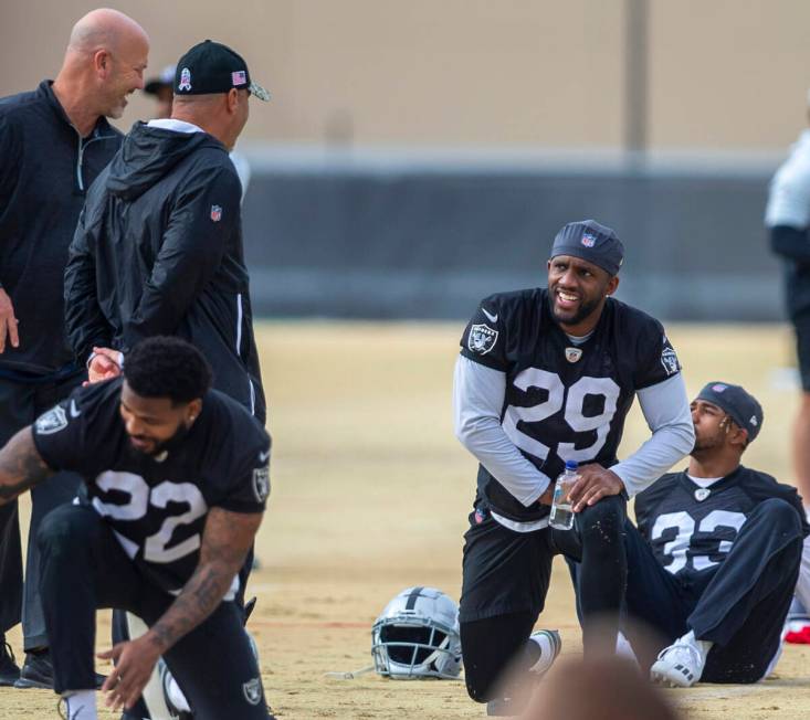 Raiders cornerback Casey Hayward (29) meets with Raiders defensive coordinator Gus Bradley, lef ...