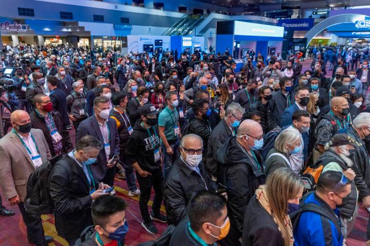 Attendees begin to file into the first day of CES during its opening at the Las Vegas Conventio ...