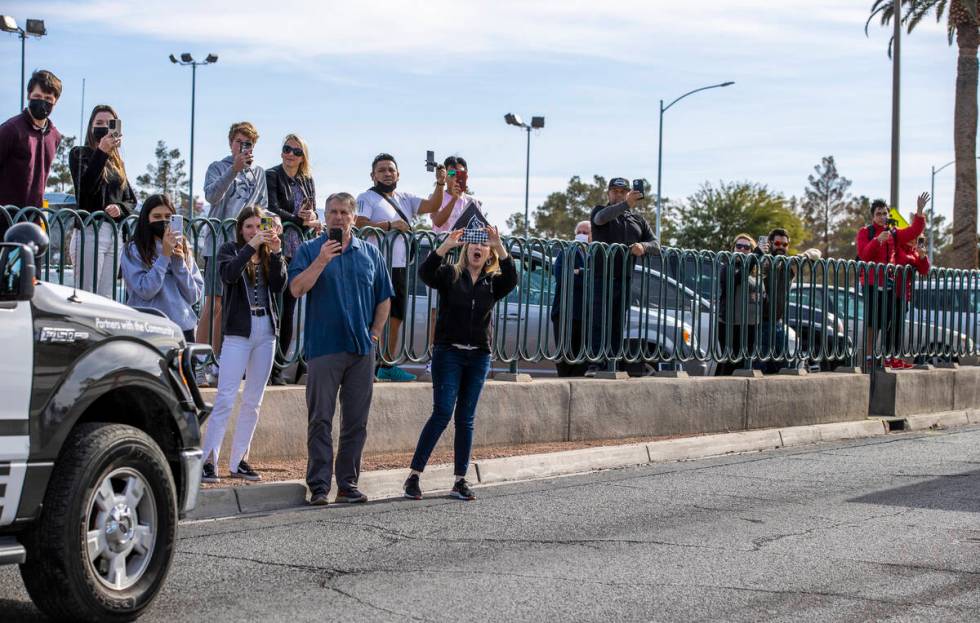 Busses with Raiders players, coaches and personnel are escorted by Metro to depart the city as ...