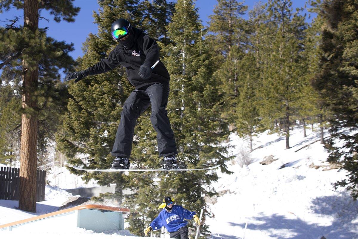 James Googe, of Las Vegas, hits a jump while snowboarding during opening day for Rabbit Peak at ...