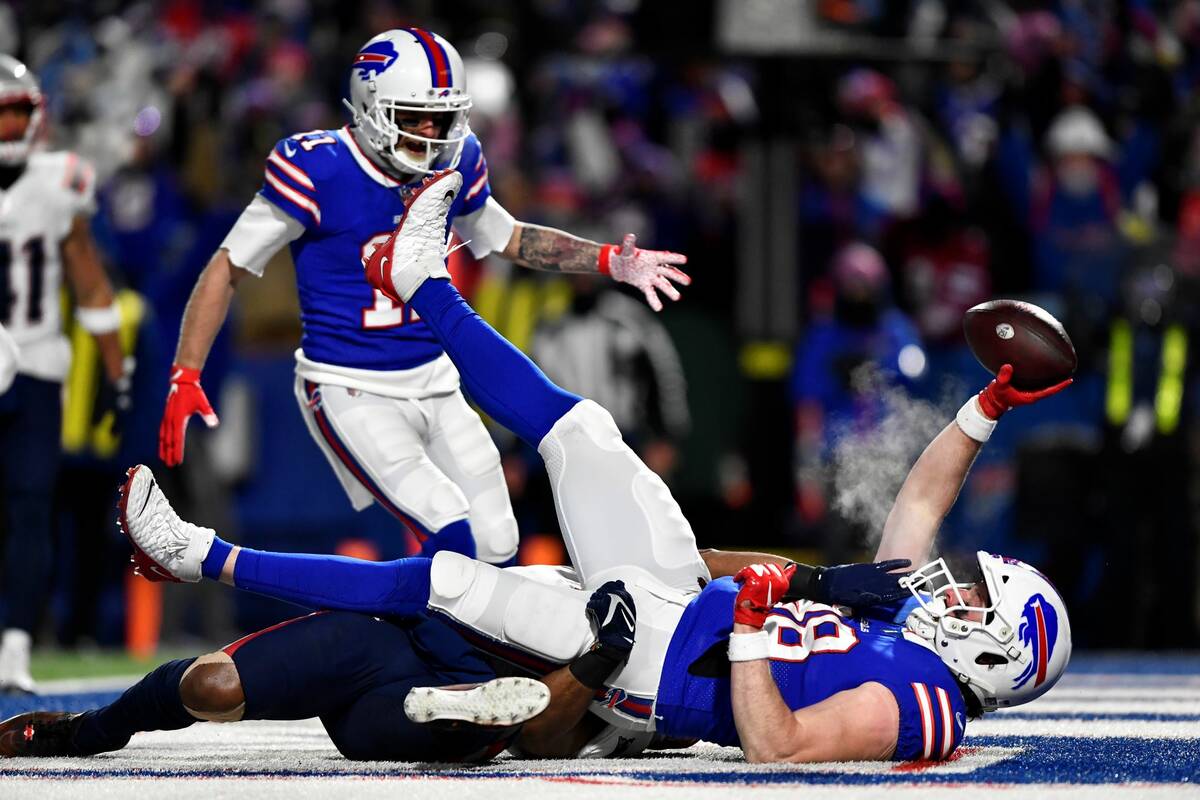 Buffalo Bills tight end Dawson Knox (88) scores a touchdown against New England Patriots safety ...