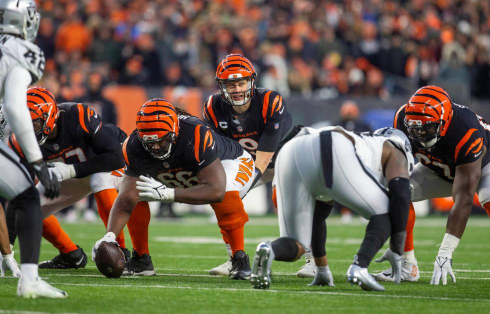 Cincinnati Bengals quarterback Joe Burrow (9) calls for the snap behind the line of scrimmage d ...