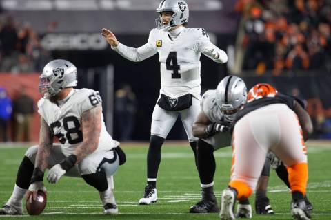 Raiders quarterback Derek Carr (4) calls a play at the line of scrimmage during the second half ...