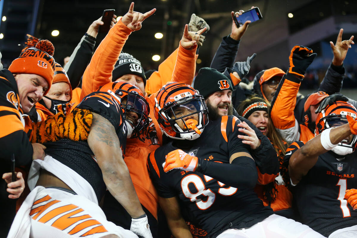 Cincinnati Bengals wide receiver Tyler Boyd (83) and running back Joe Mixon (28) celebrate a to ...