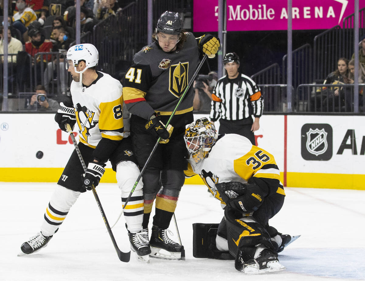 Golden Knights center Nolan Patrick (41) tries to redirect a shot past Pittsburgh Penguins goal ...