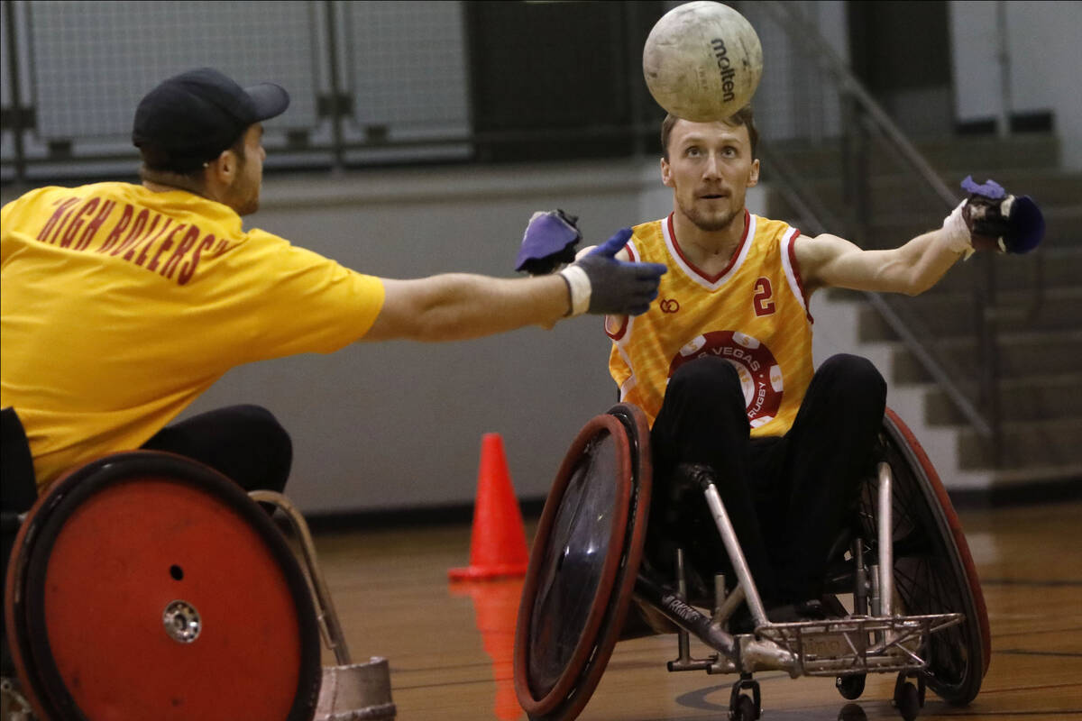 Bradley Boe, High Rollers rugby team founder and player, plays wheelchair rugby with volunteer ...