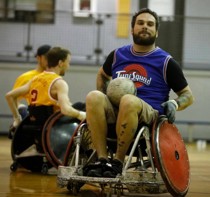Peter Vinnitsky, High Rollers coach, plays wheelchair rugby at Dula Gym during a demonstration ...