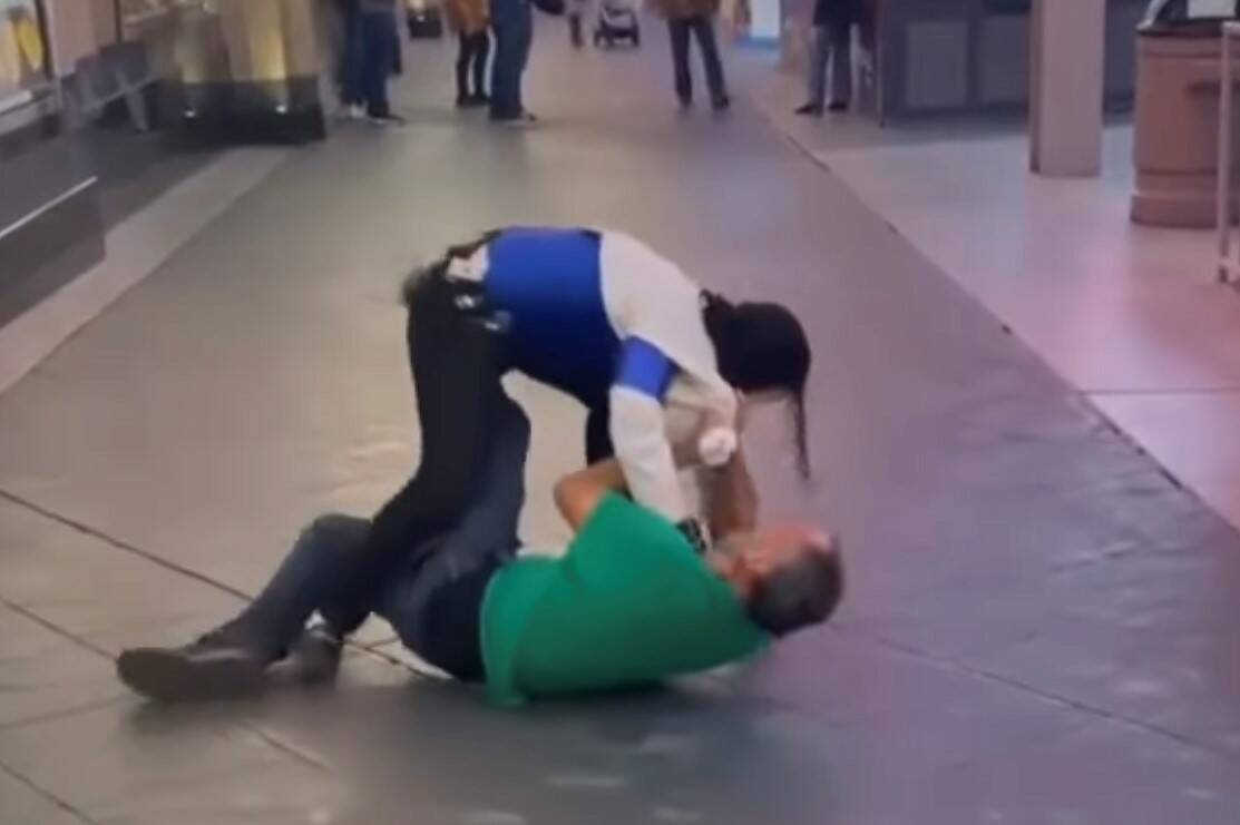 Santana Jackson is shown in a tussle with an unidentified man on Fremont Street Experience on F ...