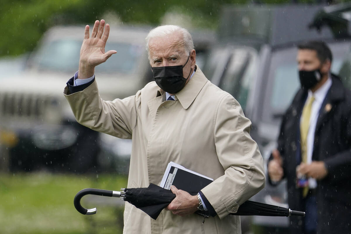 President Joe Biden waves as he walks to Marine One. (AP Photo/Patrick Semansky)