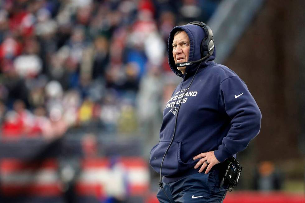 New England Patriots head coach Bill Belichick looks on during an NFL football game against the ...