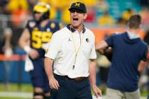 Michigan head coach Jim Harbaugh yells during warm ups before the Orange Bowl NCAA College Foot ...