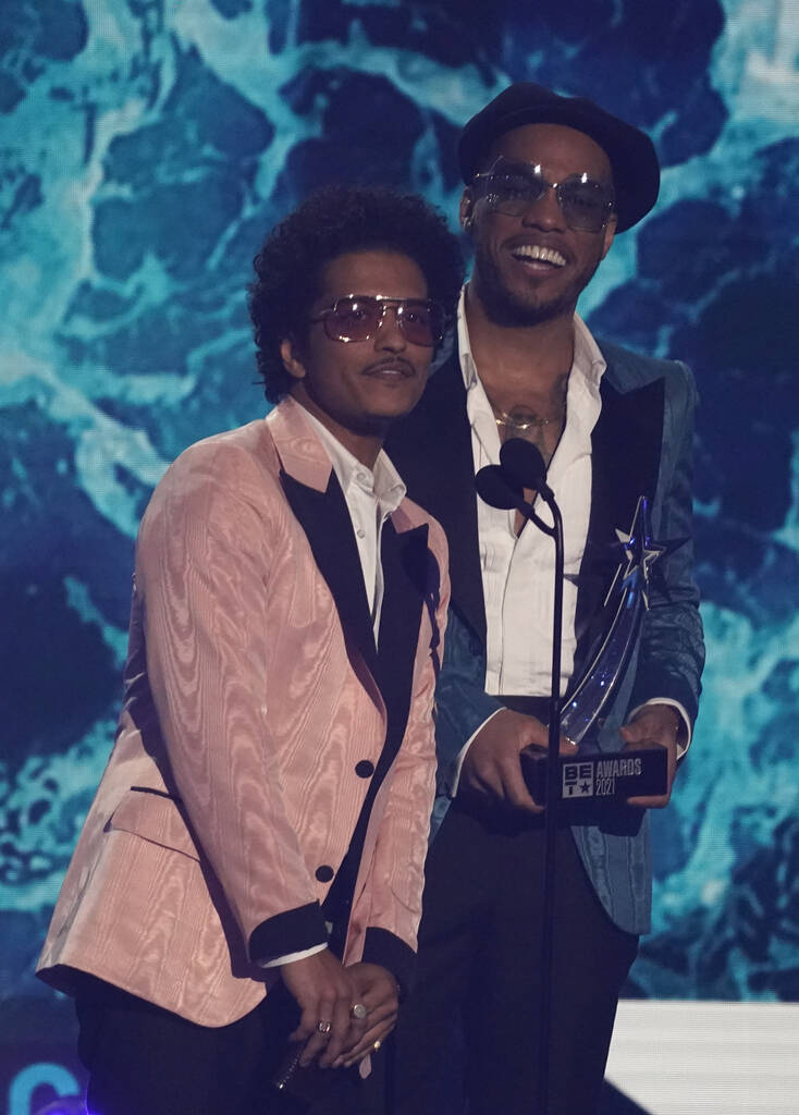 Bruno Mars, left, and Anderson .Paak, of Silk Sonic, accept the best group award at the BET Awa ...