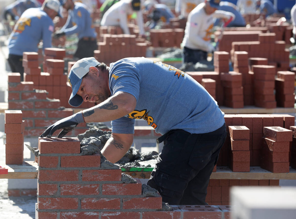 Masons, including David Chavez (1) of Ranch Masonry in Houston, compete in the Bricklayer 500 d ...