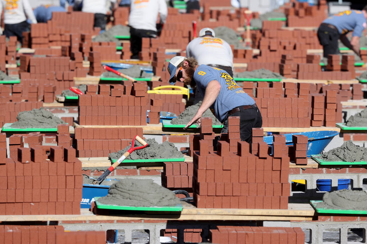 Competitors in the Bricklayer 500 during the World of Concrete construction trade show at the L ...