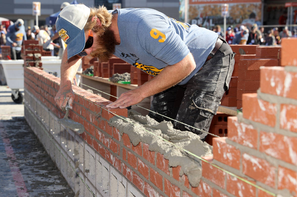 Masons, including Vince Wright (9) of Wright Masonry in Section,. Ala., compete in the Bricklay ...