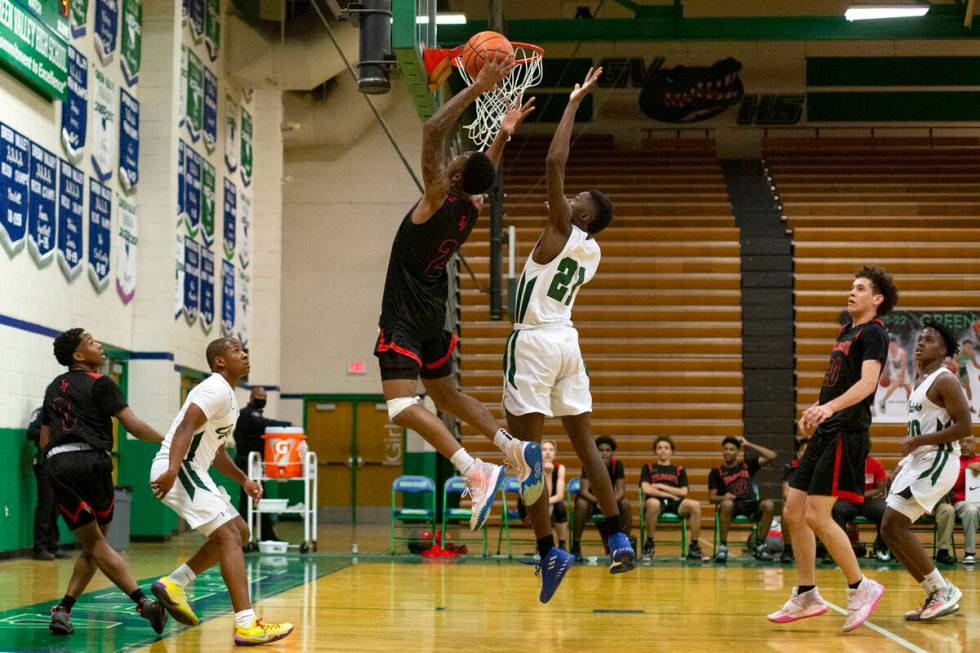 Las Vegas’ Tavi Jackson (2) shoots against Green Valley’s Kaylan Doby (21) during ...