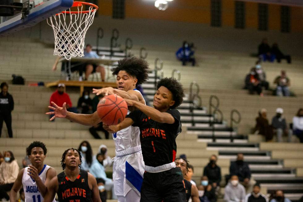 A shot by Desert Pines’ Jamir Stephens (0) is thwarted by Mojave’s Zakeus McDowel ...