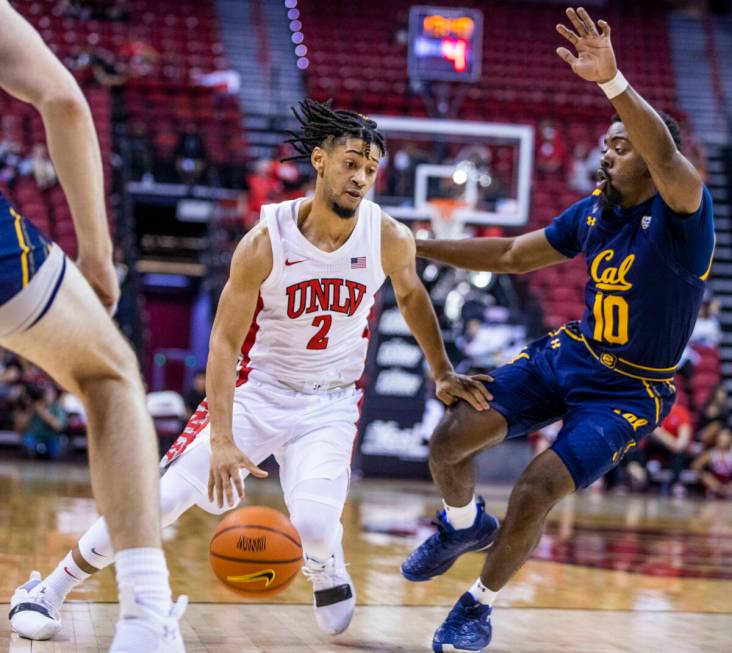 UNLV Rebels guard Justin Webster (2) looks to drive the lane past California Golden Bears guard ...