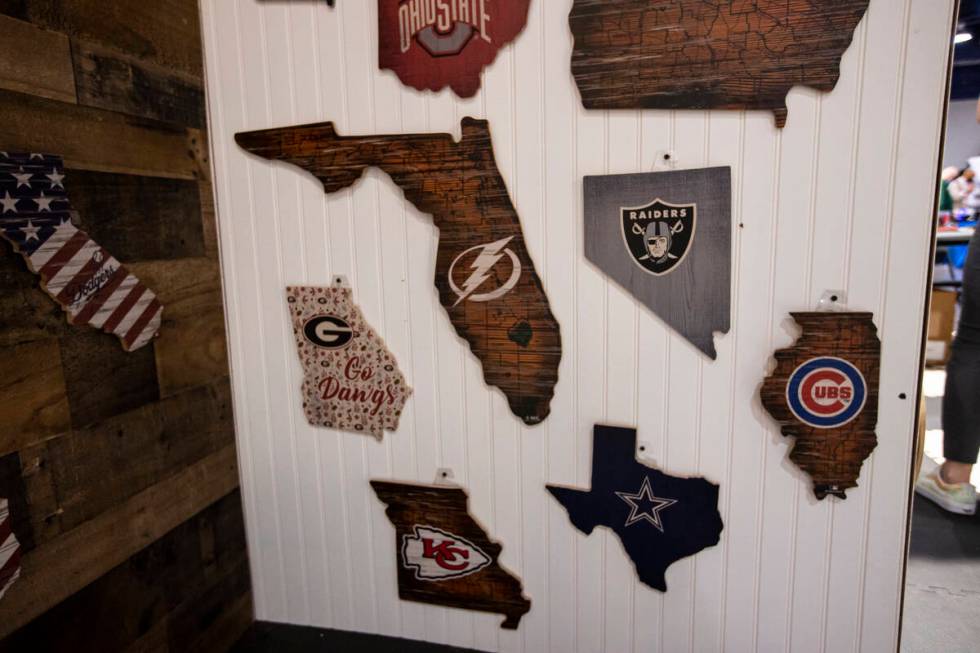 Wooden wall plaques are seen at the Fan Creations booth during the Sports Licensing & Tailg ...