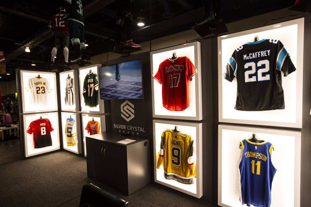 Jerseys are pictured in displays from Silver Crystal Group during the Sports Licensing & Ta ...