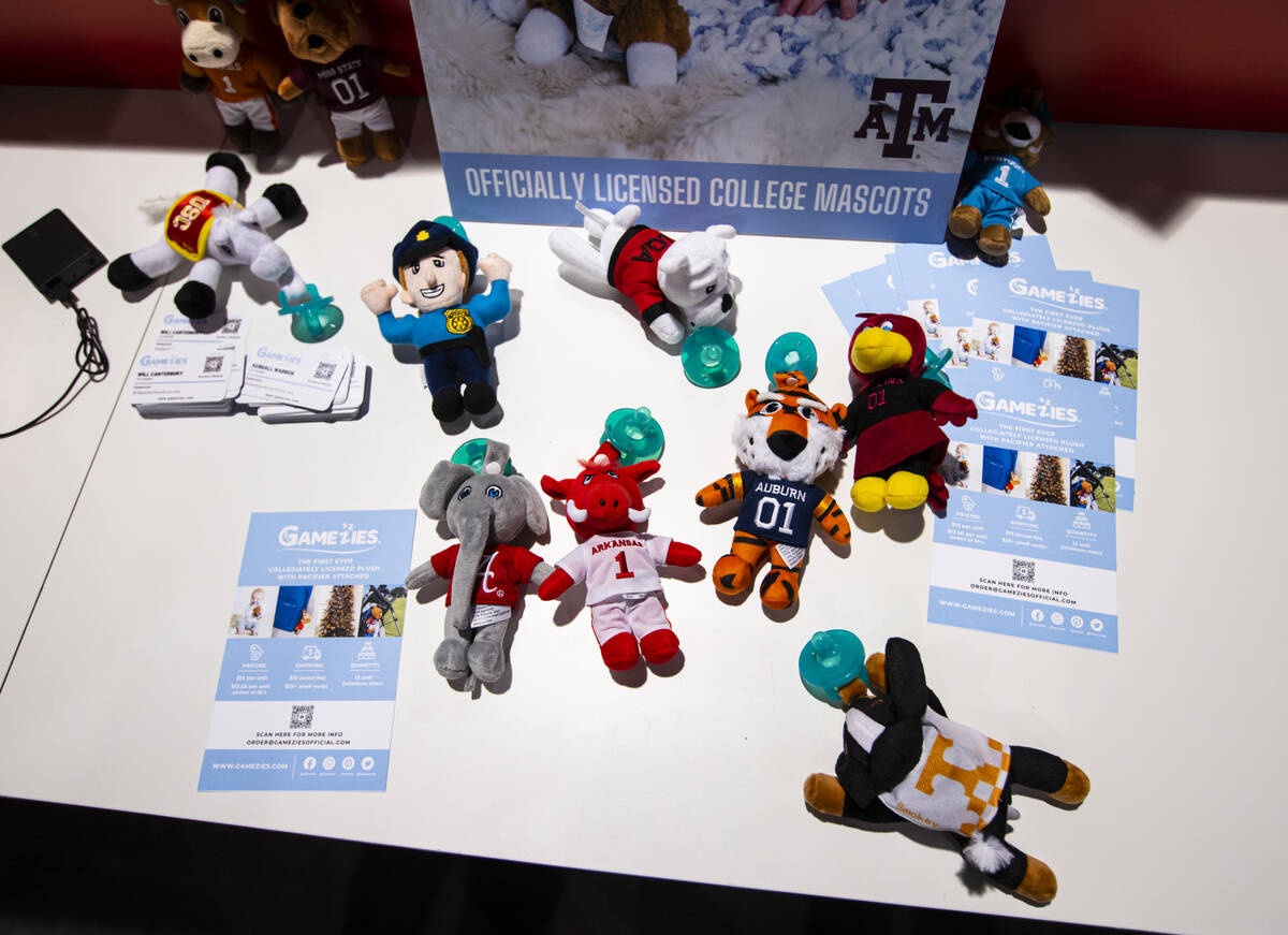 College mascot plushes with pacifiers from Gamezies are seen during the Sports Licensing & ...