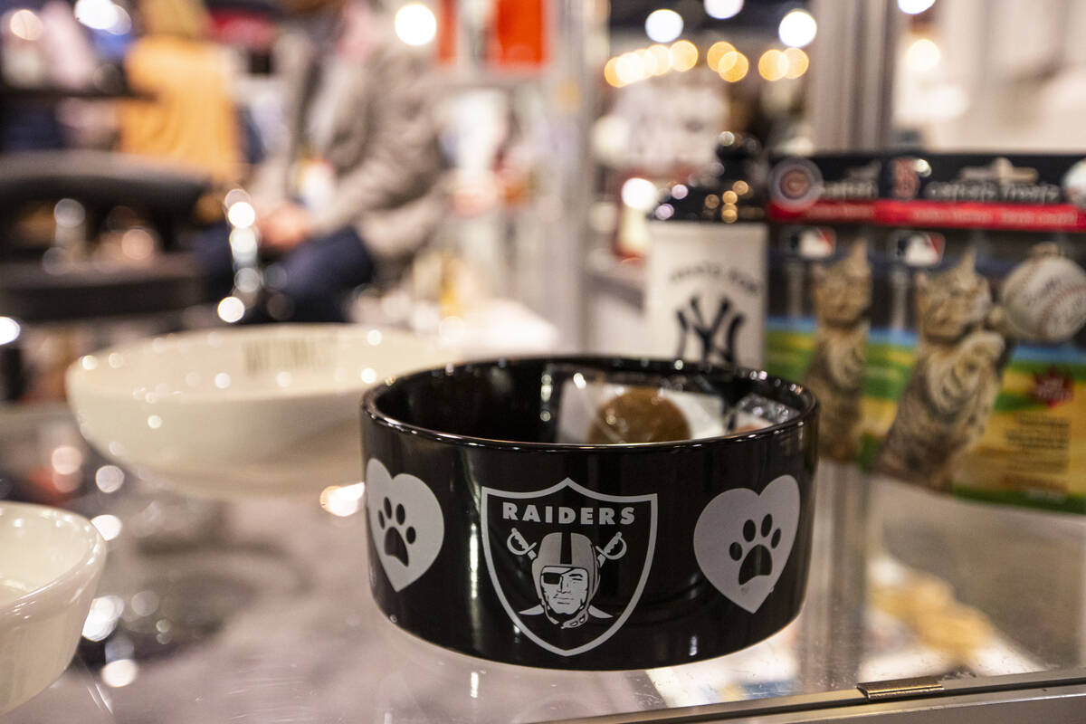 A Raiders-themed dog bowl is seen at The Memory Company booth during the Sports Licensing & ...
