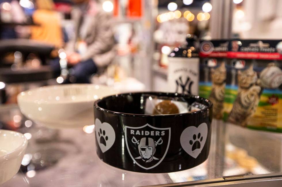 A Raiders-themed dog bowl is seen at The Memory Company booth during the Sports Licensing & ...