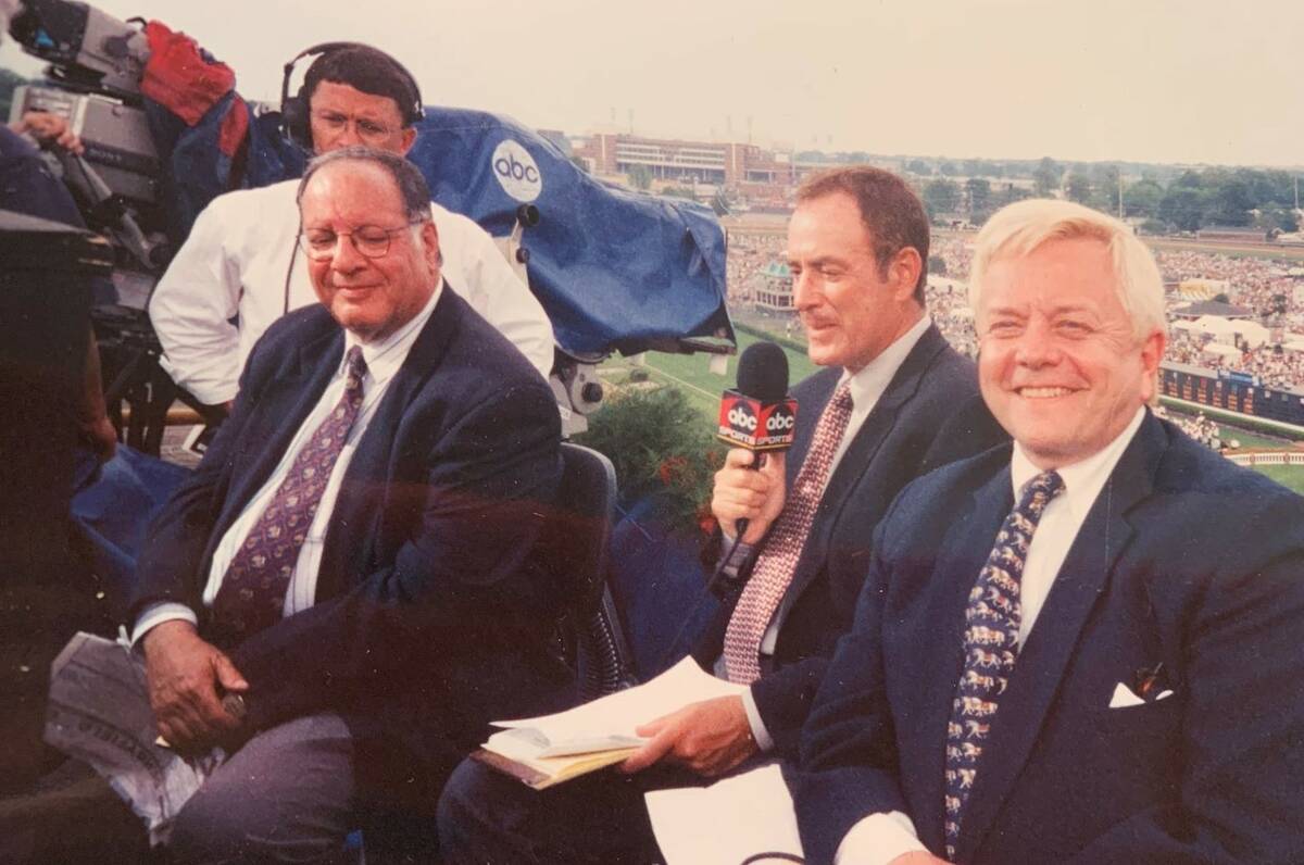 Hank Goldberg, left, sits next to Al Michaels and Dave Johnson on the ABC set at a Triple Crown ...