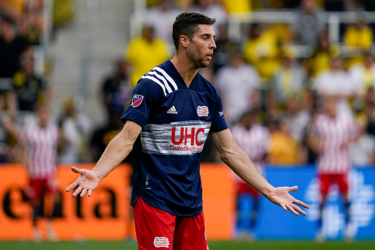 New England Revolution midfielder Matt Polster plays in the second half of an MLS match against ...