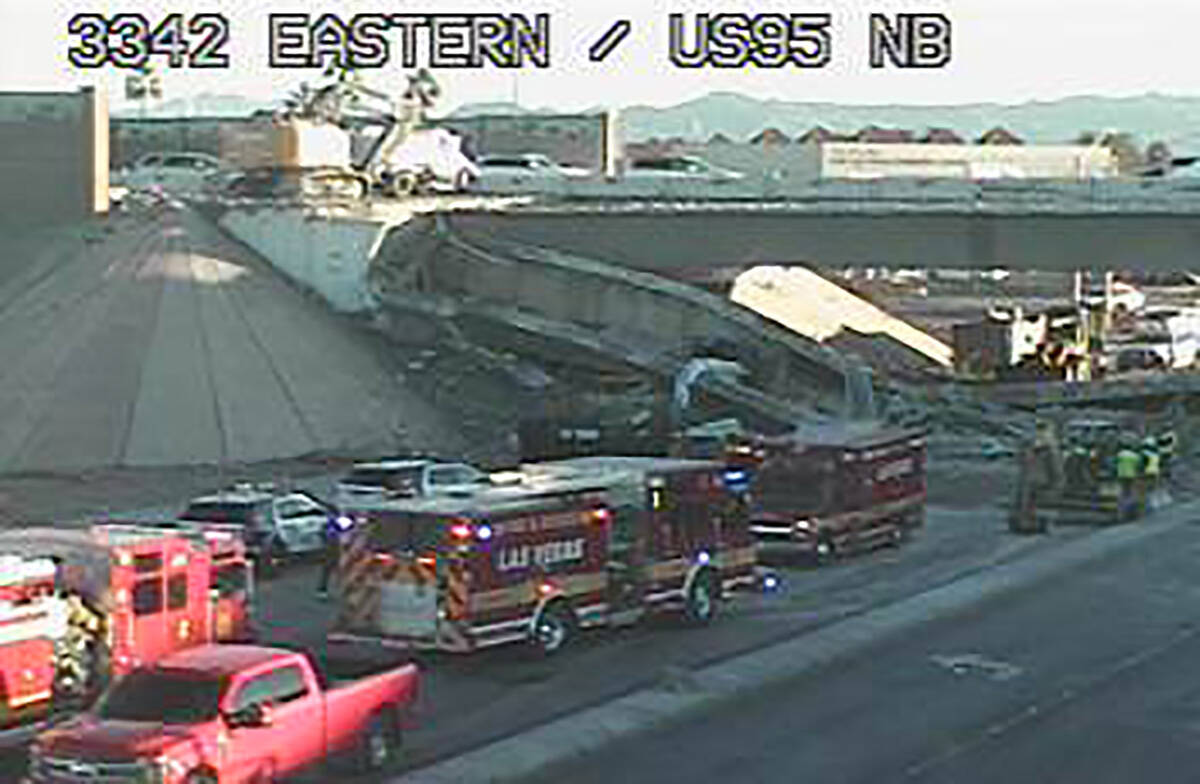 First responders at the scene of a bridge collapse at U.S. 95 and Eastern Avenue on Thursday, J ...