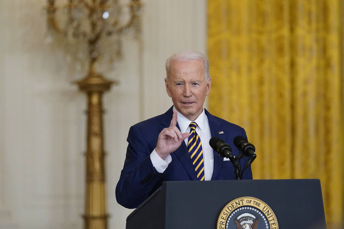 President Joe Biden speaks during a news conference in the East Room of the White House in Wash ...
