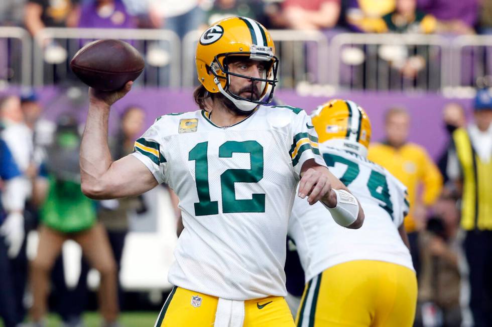 FILE - Green Bay Packers quarterback Aaron Rodgers (12) throws a pass during the first half of ...