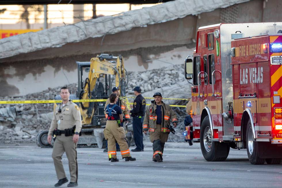 Las Vegas police and Las Vegas Fire and Rescue respond to the scene where a portion of a bridge ...