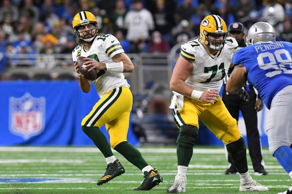 Green Bay Packers quarterback Aaron Rodgers looks downfield during the first half of an NFL foo ...