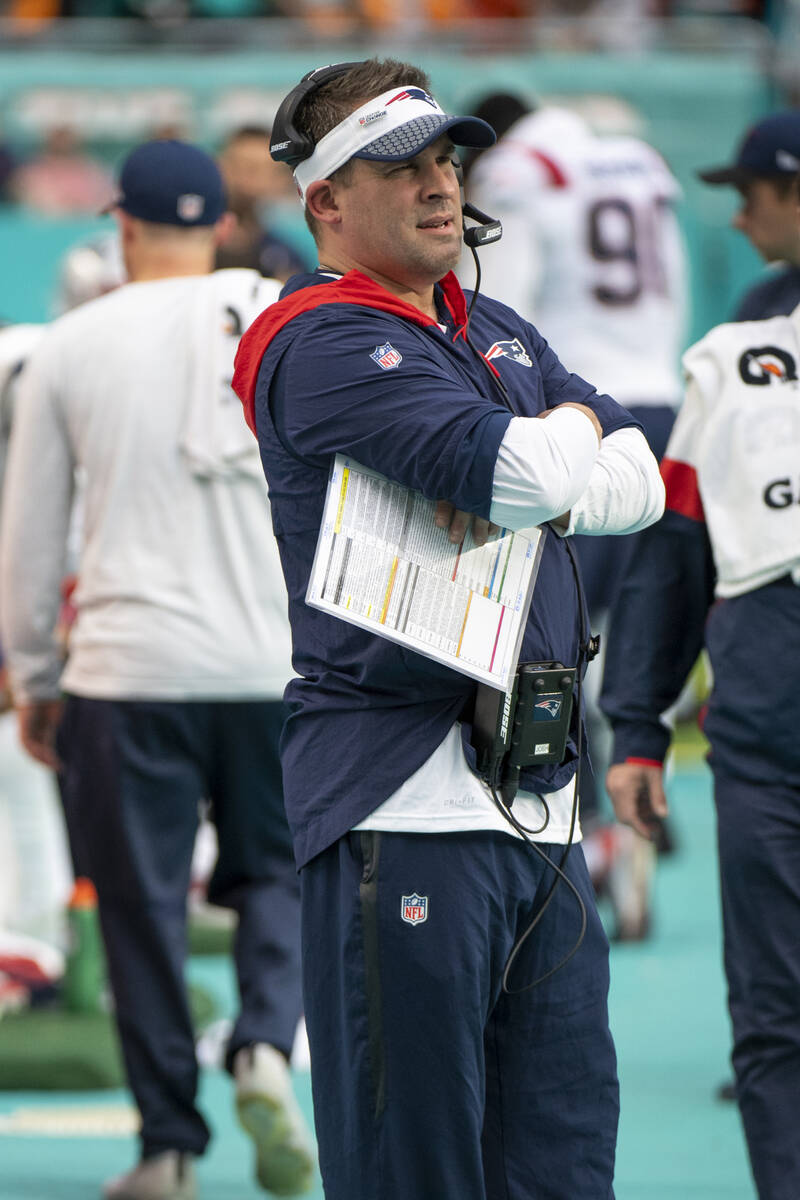 New England Patriots offensive coordinator and quarterbacks coach Josh McDaniels watches from t ...