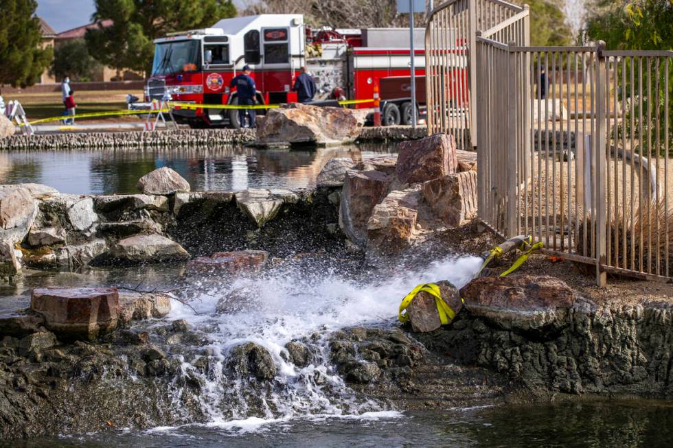 North Las Vegas firefighters keep the water flowing as the ponds at Aliante Nature Park are bei ...