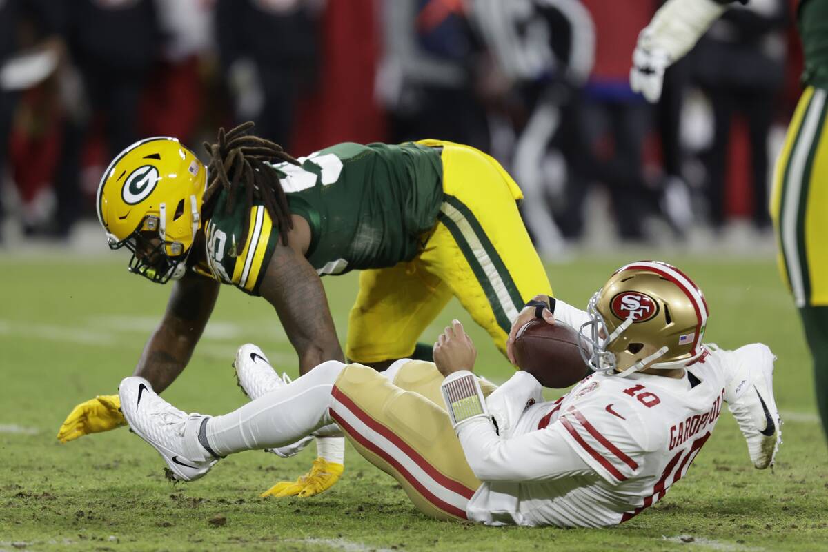 Green Bay Packers' Za'Darius Smith sacks San Francisco 49ers' Jimmy Garoppolo during the first ...