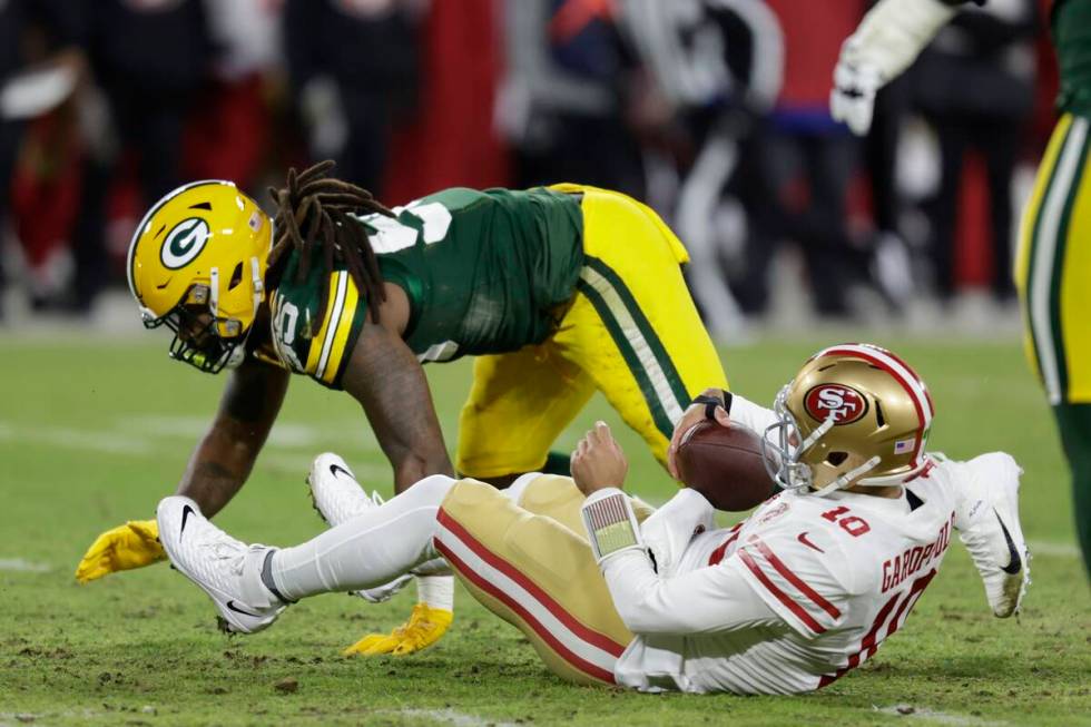 Green Bay Packers' Za'Darius Smith sacks San Francisco 49ers' Jimmy Garoppolo during the first ...