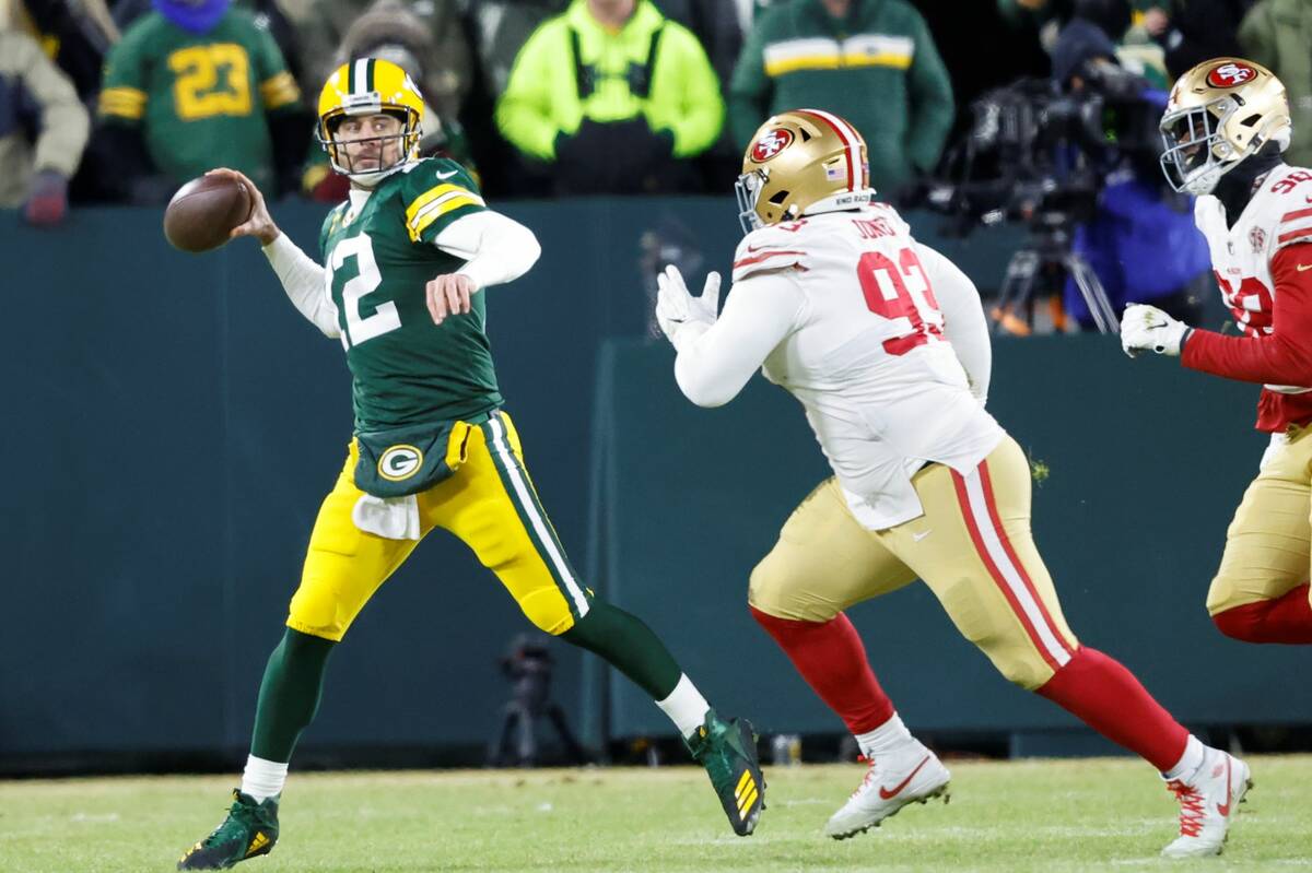 Green Bay Packers quarterback Aaron Rodgers (12) looks to throw against San Francisco 49ers dur ...
