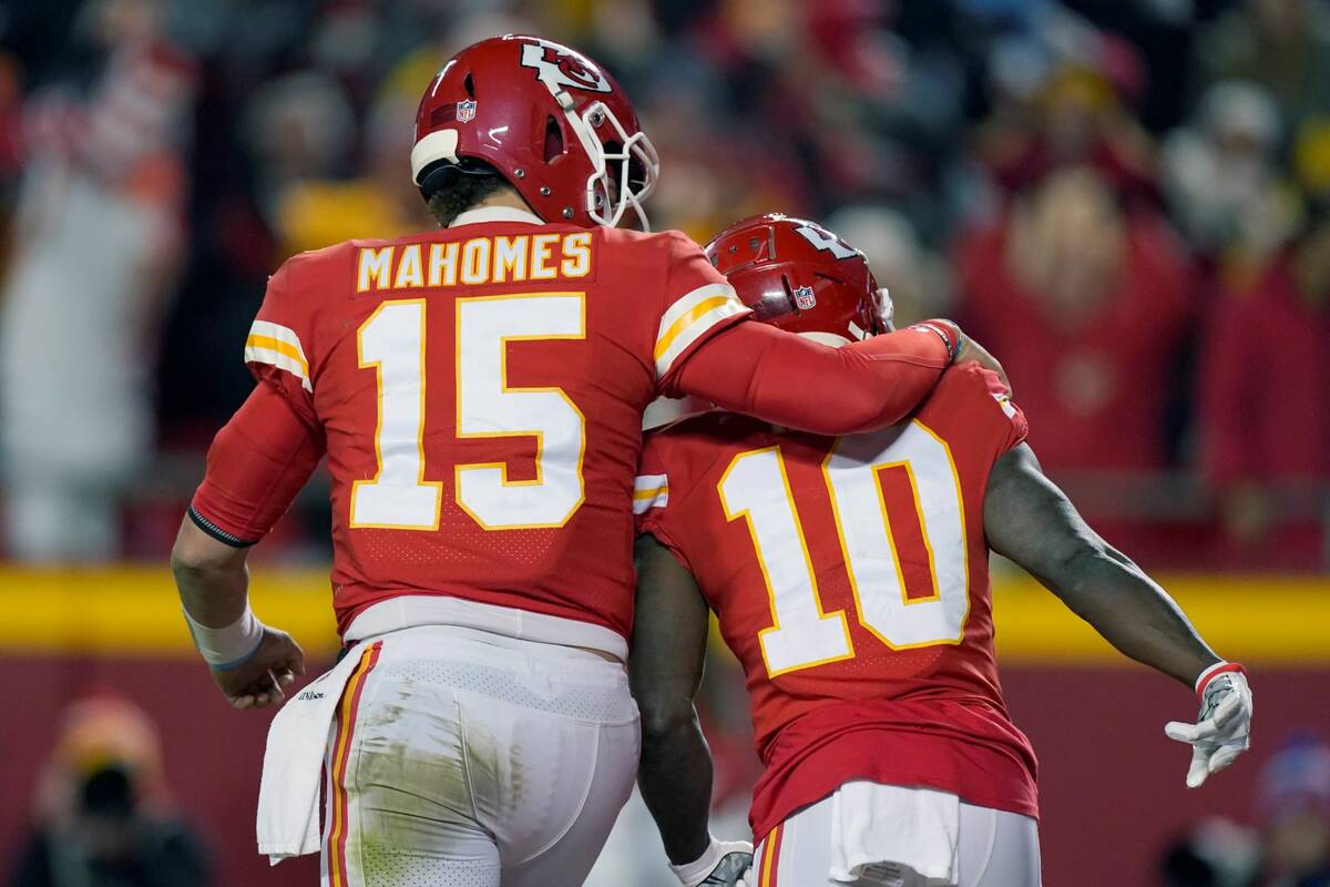 Kansas City Chiefs wide receiver Tyreek Hill (10) celebrates with teammate Patrick Mahomes (15) ...
