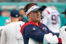 New England Patriots offensive coordinator and quarterbacks coach Josh McDaniels watches from t ...