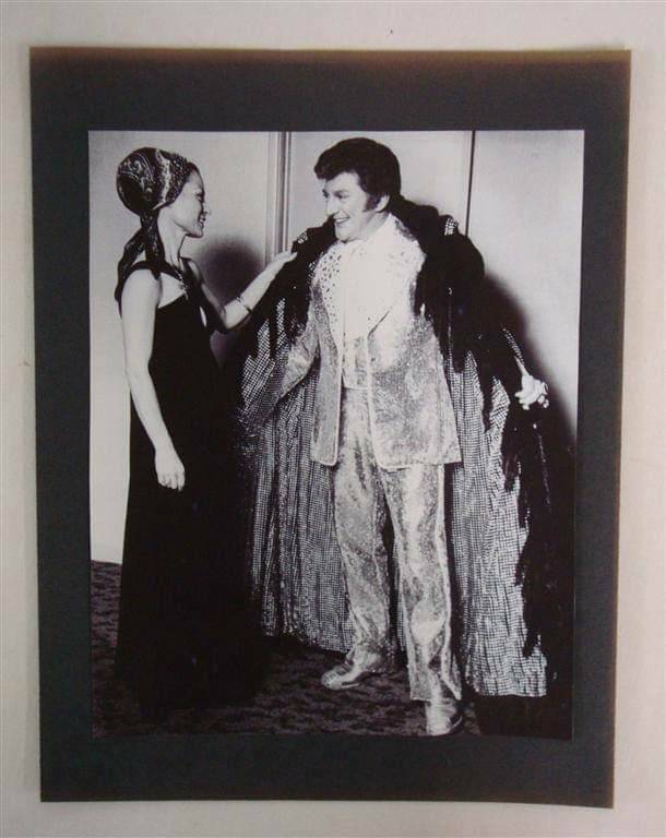 Anna Nateece, star fashion designer who created Liberace's famous furs, is shown with "Mr. Show ...