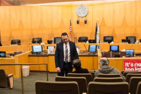 Attorney Michael Troiano consults with Allan Williams and Sharon Williams on Monday, Jan. 24, 2 ...