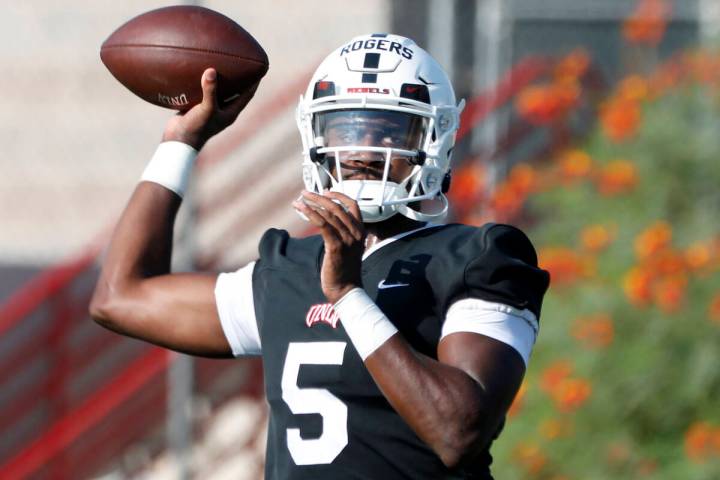 UNLV Rebels quarterback Justin Rogers (5) throws a ball during football practice in UNLV, Wedne ...