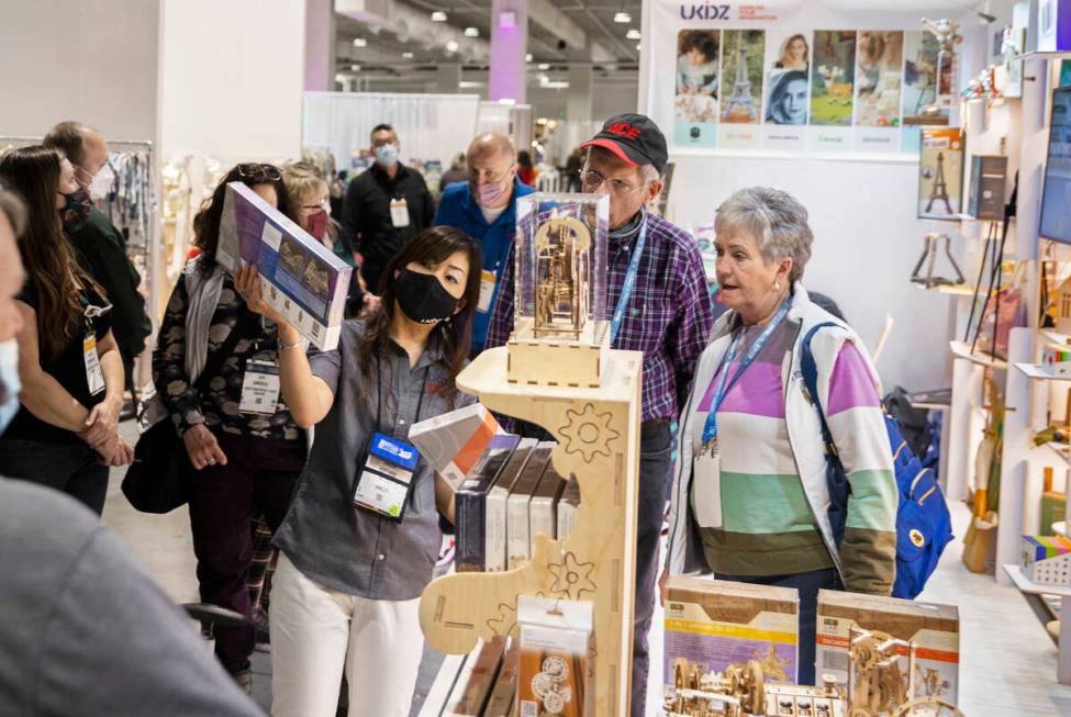 Keiko Webb, middle, with Ukidz LLC, talks with conventiongoers during the Las Vegas Market at W ...
